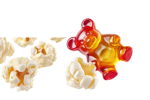 Kilka kawałków popcornu i żelka w kształcie misia na białym tle – przykłady przekąsek, które mogą mieć wpływ na użytkowanie nakładek ortodontycznych Invisalign®.