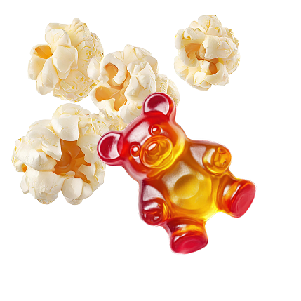 Kilka kawałków popcornu i żelka w kształcie misia na białym tle – przykłady przekąsek, które mogą mieć wpływ na użytkowanie nakładek ortodontycznych Invisalign®.